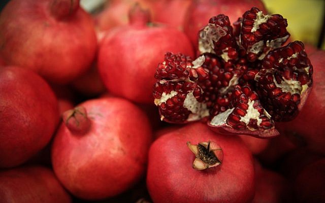 Pomegranates sold for the upcoming Jewish New Year, Rosh Hashana, at the Mahane Yehuda market in Jerusalem, on September 8, 2014. (Hadas Parush/Flash90) Pomegranates sold for the upcoming Jewish New Year, Rosh Hashana, at the Mahane Yehuda market in Jerusalem, on September 8, 2014. (Hadas Parush/Flash90)