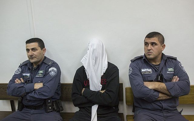 Ben Deri, center, a Border Police officer accused of shooting to death a Palestinian man during clashes in Betunia in the West Bank, seen during a hearing at the District Court in Jerusalem on December 30, 2014. (Yonatan Sindel/Flash90) Ben Deri, center, a Border Police officer accused of shooting to death a Palestinian man during clashes in Betunia in the West Bank, seen during a hearing at the District Court in Jerusalem on December 30, 2014. (Yonatan Sindel/Flash90)