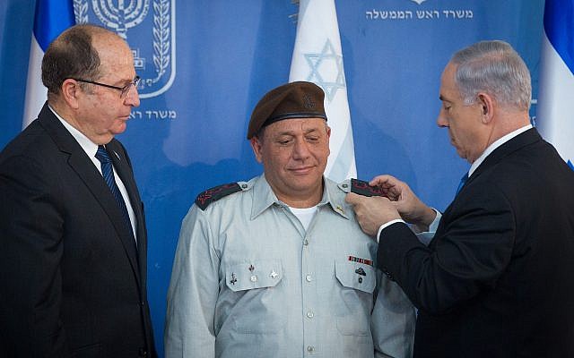 Prime Minister Benjamin Netanyahu (R), then-defense minister Moshe Ya'alon (L) and IDF Chief of Staff Gadi Eisenkot at a swearing in ceremony for Eisenkot at the Prime Minister's Office in Jerusalem on February 16, 2015. (Miriam Alster/Flash90) Prime Minister Benjamin Netanyahu (R), then-defense minister Moshe Ya'alon (L) and IDF Chief of Staff Gadi Eisenkot at a swearing in ceremony for Eisenkot at the Prime Minister's Office in Jerusalem on February 16, 2015. (Miriam Alster/Flash90)