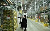 Illustrative: Kashrut supervisors inspect produce at a fruit and vegetable warehouse on March 20, 2016. (Yaakov Naumi/FLASH90)