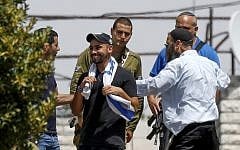 Elor Azaria, center, visits in the West Bank city of Hebron following his release from prison where he served a sentence for the 2016 manslaughter of an incapacitated Palestinian attacker he shot in the city during his military service, July 3, 2018. (Wisam Hashlamoun/Flash90)