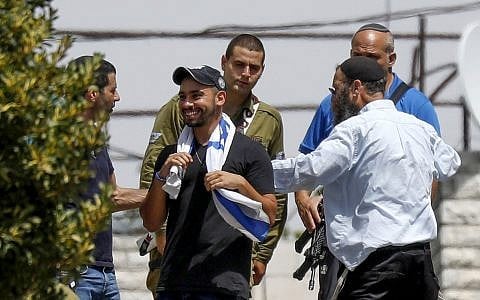 Elor Azaria, center, visits in the West Bank city of Hebron following his release from prison where he served a sentence for the 2016 manslaughter of an incapacitated Palestinian attacker he shot in the city during his military service, July 3, 2018. (Wisam Hashlamoun/Flash90)