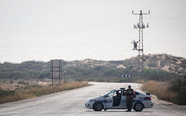 A Military Police car blocks a road leading to Zikim beach after it was closed to visitors, due to escalating rocket fire from the Gaza Strip toward southern Israel, on July 14, 2018. (Hadas Parush/Flash90) A Military Police car blocks a road leading to Zikim beach after it was closed to visitors, due to escalating rocket fire from the Gaza Strip toward southern Israel, on July 14, 2018. (Hadas Parush/Flash90)