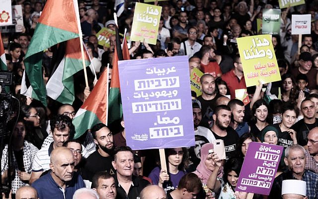 Illustrative: Israeli Arabs and Jews protest against the 'Nation-state Law' in Tel Aviv on August 11, 2018. (Tomer Neuberg/Flash90)