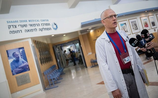 Dr. David Raveh-Brawer gives a statement about several cases of leptospirosis in the Golan Heights, at the Shaare Zedek Medical Center in Jerusalem on August 13, 2018. (Yonatan Sindel/Flash90) Dr. David Raveh-Brawer gives a statement about several cases of leptospirosis in the Golan Heights, at the Shaare Zedek Medical Center in Jerusalem on August 13, 2018. (Yonatan Sindel/Flash90)
