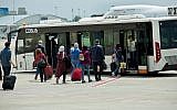 Travellers seen being transferred from the airplane to the arrival hall of Ben Gurion International Airport, near Tel Aviv, on April 11, 2018. (Moshe Shai/FLASH90)