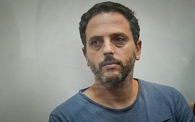 Beno Reinhorn, a youth sports coach suspected of molesting dozens of underage girls online, is seen at the Rishon Lezion Magistrate's Court on August 20, 2018. (Flash90)