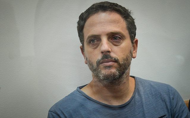 Beno Reinhorn, a youth sports coach suspected of molesting dozens of underage girls online, is seen at the Rishon Lezion Magistrate's Court on August 20, 2018. (Flash90) Beno Reinhorn, a youth sports coach suspected of molesting dozens of underage girls online, is seen at the Rishon Lezion Magistrate's Court on August 20, 2018. (Flash90)
