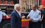 US Ambassador to Israel David Friedman, left, and Israeli Fire and Rescue Services Commissioner Dedi Simhi meeting at Sderot's fire station, August 1, 2018. (Avida Landau/US Embassy in Israel)
