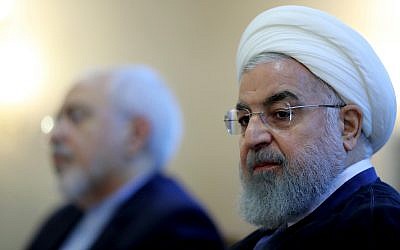 In this photo released by official website of the office of the Iranian Presidency, President Hassan Rouhani attends a meeting with a group of foreign ministry officials in Tehran, Iran. Sunday, July 22, 2018. (Iranian Presidency Office via AP)