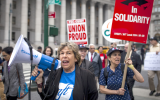Randi Weingarten, with megaphone, marches in a New York City rally, June 27, 2018. (Courtesy Professional Staff Congress/via JTA)