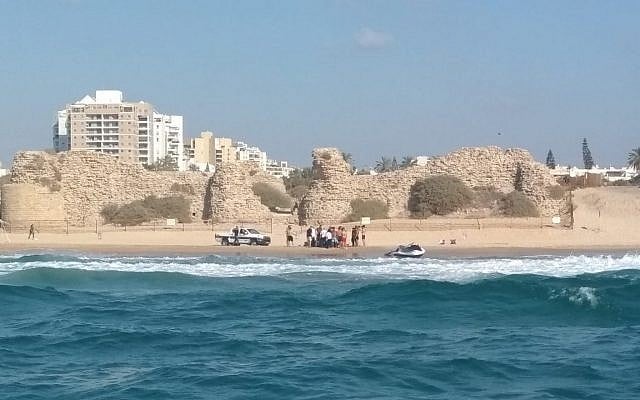 Medics attempt to resuscitate a man at an unauthorized beach in Ashdod on August 19, 2018. (Israel Police) Medics attempt to resuscitate a man at an unauthorized beach in Ashdod on August 19, 2018. (Israel Police)