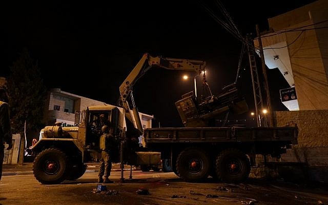 Israeli soldiers confiscate machinery from a suspected gun manufacturing workshop in the village of Yatta in the southern West Bank on August 14, 2018. (Israel Defense Forces) Israeli soldiers confiscate machinery from a suspected gun manufacturing workshop in the village of Yatta in the southern West Bank on August 14, 2018. (Israel Defense Forces)