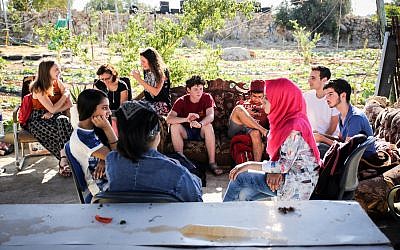 Illustrative: Palestinians and Israelis in dialogue at the Roots Center in the West Bank. (Courtesy of Roots)