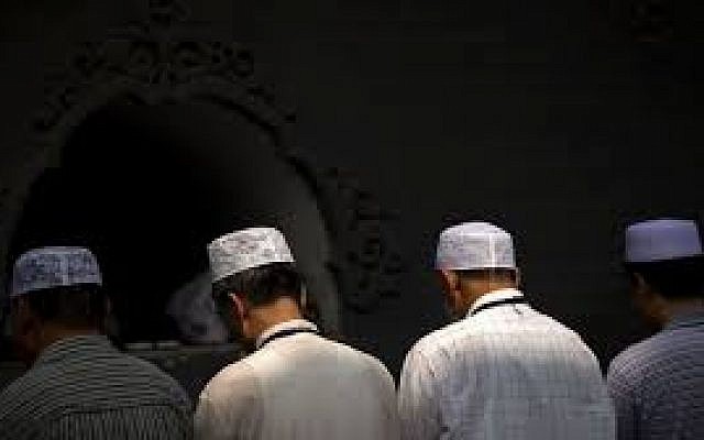 In this July 18, 2015, file photo, Chinese Hui Muslims pray during Eid al-Fitr prayers at Niujie Mosque in Beijing. (AP Photo/Mark Schiefelbein, File) In this July 18, 2015, file photo, Chinese Hui Muslims pray during Eid al-Fitr prayers at Niujie Mosque in Beijing. (AP Photo/Mark Schiefelbein, File)