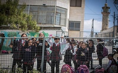 Illustrative image of Palestinian schoolgirls in their small playground in the East Jerusalem neighborhood of Shuafat, on March 30, 2016. (Hadas Parush/Flash90)