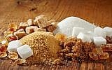 Various types of sugar on a wooden table. (iStock by Getty Images, MagoneJ)