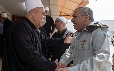 IDF chief of staff, Gadi Eisenkot (R), visits the Druze tomb of Sheikh Amin Tarif in the village of Julis on August 17, 2018. (IDF spokesman)