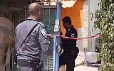 Police at the scene of a suspected murder in Beit Yael homeless shelter in Netanya on August 2, 2018. (Screen capture: Ynet news)