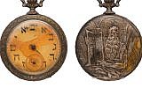 A pocket watch with Hebrew letters on its face that belonged to a Jewish Russian immigrant who died aboard the Titanic. (Twitter via JTA)