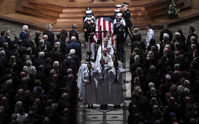 The casket of the late US Senator John McCain, Republican of Arizona, is carried out after the National Memorial Service at the Washington National Cathedral in Washington, DC, September 1, 2018. (AFP PHOTO / SAUL LOEB) The casket of the late US Senator John McCain, Republican of Arizona, is carried out after the National Memorial Service at the Washington National Cathedral in Washington, DC, September 1, 2018. (AFP PHOTO / SAUL LOEB)