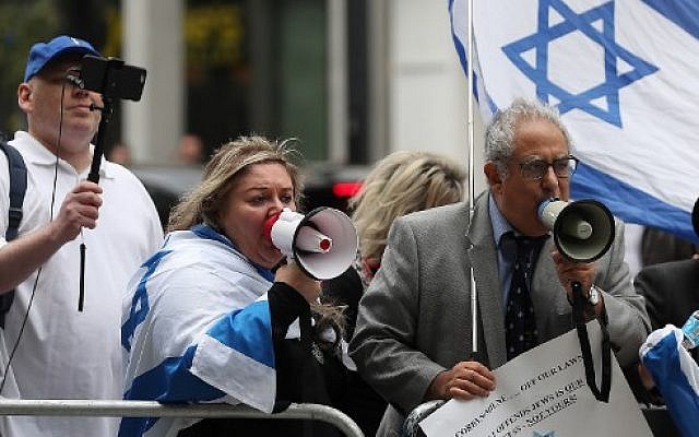 Demonstrators hold placards and flags of Israel as they protest outside the headquarters of Britain's opposition Labour party in central London on September 4, 2018. (AFP Photo/Daniel Leal-Olivas) Demonstrators hold placards and flags of Israel as they protest outside the headquarters of Britain's opposition Labour party in central London on September 4, 2018. (AFP Photo/Daniel Leal-Olivas)
