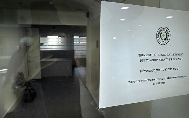 A picture shows the empty entrance and a sign on the door of Paraguay's closed embassy in Jerusalem on September 6, 2018. (AFP / THOMAS COEX) A picture shows the empty entrance and a sign on the door of Paraguay's closed embassy in Jerusalem on September 6, 2018. (AFP / THOMAS COEX)