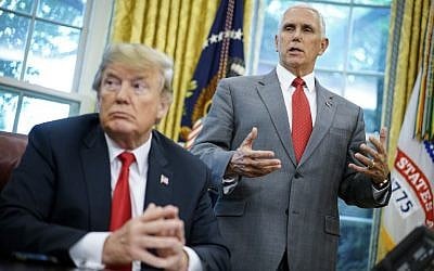 In this file photo taken on June 20, 2018 US Vice President Mike Pence speaks as US President Donald Trump looks on before signing an executive order on immigration in the Oval Office of the White House in Washington, DC. (AFP PHOTO / Mandel Ngan)