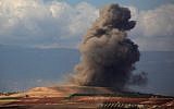 Smoke rises near the Syrian village of Kafr Ain in the southern countryside of Idlib province after an airstrike on September 7, 2018. (AFP Photo/Anas Al-Dyab)