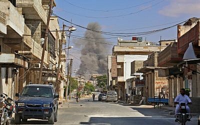 This picture taken in Kafr Ain on September 7, 2018, shows smoke rising as government forces target the city, 4 kilometers east of Khan Sheikhoun in the southern countryside of Idlib province. (AFP Photo/Anas Al-Dyab)