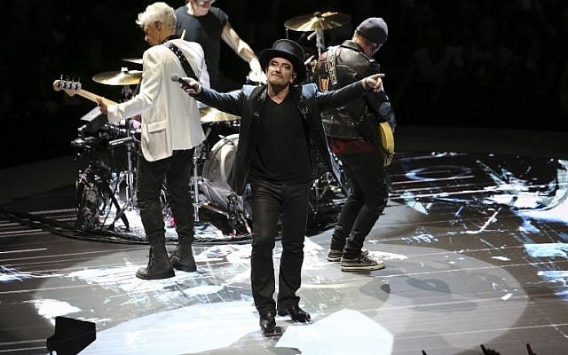 Irish lead singer of rock band U2, Bono, center, performs on stage in Paris on September 8, 2018. (Zakaria ABDELKAFI/AFP) Irish lead singer of rock band U2, Bono, center, performs on stage in Paris on September 8, 2018. (Zakaria ABDELKAFI/AFP)