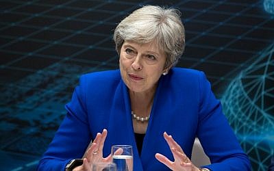 Britain's Prime Minister Theresa May addresses business leaders at the Zero Emission Vehicle Summit in Birmingham, central England on September 11, 2018. (AFP PHOTO / POOL / Aaron Chown)