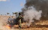 A Syrian rebel fighter from the recently-formed "National Liberation Front" takes part in combat training at an unknown location in the northern countryside of the Idlib province on September 11, 2018, in anticipation for an upcoming offensive by government forces. (AFP Photo/Aaref Watad)