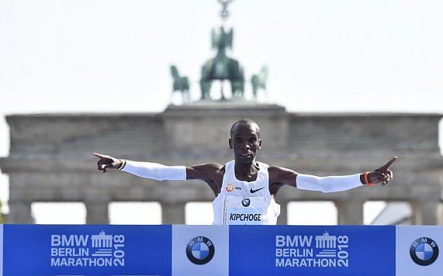 Kenya's Eliud Kipchoge crosses the finish line to win the Berlin Marathon setting a new world record on September 16, 2018 in Berlin. (AFP PHOTO / John MACDOUGALL) Kenya's Eliud Kipchoge crosses the finish line to win the Berlin Marathon setting a new world record on September 16, 2018 in Berlin. (AFP PHOTO / John MACDOUGALL)