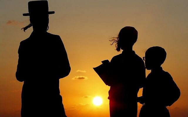 Ultra-Orthodox Jewish men pray along the Mediterranean Sea in the Israeli city of Herzliya, near Tel Aviv, while performing the 'Tashlich' ritual on September 17, 2018, during which 'sins' are cast into the water performed before the Day of Atonement, or Yom Kippur, the most important day in the Jewish calendar, which this year will start at sunset on September 18. (AFP/Jack Guez) Ultra-Orthodox Jewish men pray along the Mediterranean Sea in the Israeli city of Herzliya, near Tel Aviv, while performing the 'Tashlich' ritual on September 17, 2018, during which 'sins' are cast into the water performed before the Day of Atonement, or Yom Kippur, the most important day in the Jewish calendar, which this year will start at sunset on September 18. (AFP/Jack Guez)
