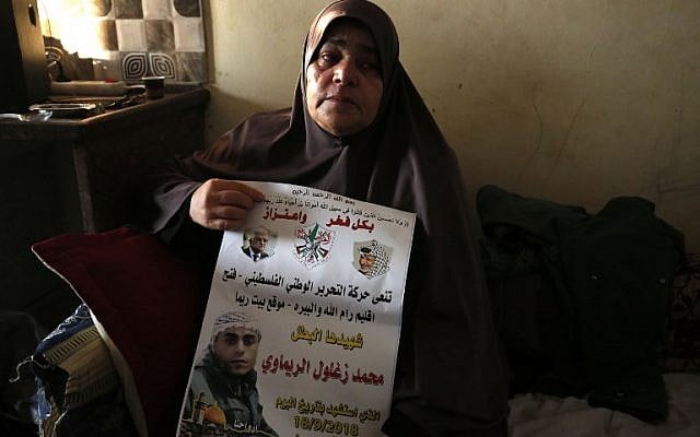 The mother of 24-year-old Palestinian Muhammad Zaghloul Khatib sits at the family's home in the West Bank village of Bayt Rima, north of Ramallah, on September 18, 2018. (AFP Photo/Abbas Momani) The mother of 24-year-old Palestinian Muhammad Zaghloul Khatib sits at the family's home in the West Bank village of Bayt Rima, north of Ramallah, on September 18, 2018. (AFP Photo/Abbas Momani)