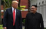 In this file photo taken on June 11, 2018, North Korean strongman Kim Jong Un, right, walks with US President Donald Trump, left, during a break in talks at their summit meeting on Sentosa island in Singapore. (AFP /Saul Loeb)