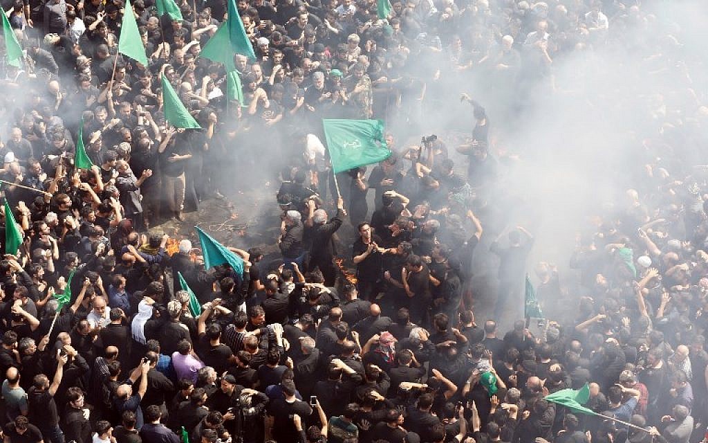 Iranian Shiite Muslims burn a tent during the reenactment of the Battle of Karbala, in Tehran on September 20, 2018, during the annual Ashura commemorations (AFP PHOTO / STR)