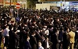 Ultra-Orthodox protesters block a road during a demonstration against light rail construction work on Shabbat on the outskirts of Bnei Brak, near Tel Aviv, on September 21, 2018. (AFP Photo/Jack Guez)