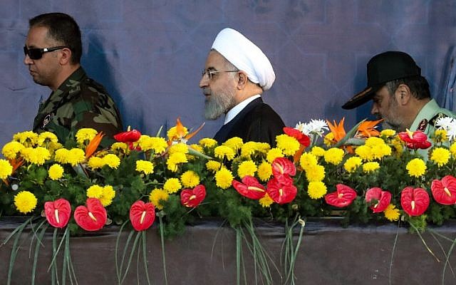 Iranian President Hassan Rouhani arrives to attend the annual military parade marking the anniversary of the outbreak of the devastating 1980-1988 war with Saddam Hussein's Iraq, in the capital Tehran on September 22, 2018. (AFP/ STRINGER) Iranian President Hassan Rouhani arrives to attend the annual military parade marking the anniversary of the outbreak of the devastating 1980-1988 war with Saddam Hussein's Iraq, in the capital Tehran on September 22, 2018. (AFP/ STRINGER)