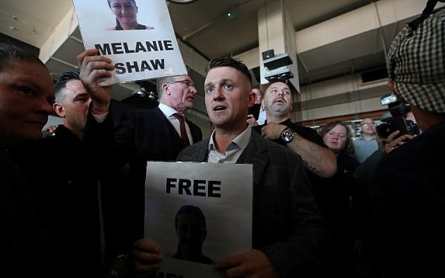 Stephen Christopher Yaxley-Lennon (C), AKA Tommy Robinson, former leader of the right-wing EDL (English Defence League) is greeted by supporters as he enters a pub, in central London on September 27, 2018, after his contempt of court hearing at the Central Criminal Court was adjourned. (AFP PHOTO / Daniel LEAL-OLIVAS) Stephen Christopher Yaxley-Lennon (C), AKA Tommy Robinson, former leader of the right-wing EDL (English Defence League) is greeted by supporters as he enters a pub, in central London on September 27, 2018, after his contempt of court hearing at the Central Criminal Court was adjourned. (AFP PHOTO / Daniel LEAL-OLIVAS)