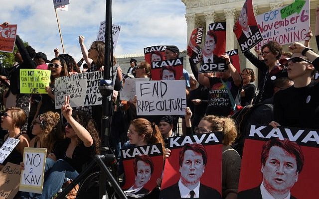 Activist demonstrate against US Supreme Court nominee Brett Kavanaugh in front of the court in Washington, DC, on September 28, 2018. (AFP/Eric BARADAT) Activist demonstrate against US Supreme Court nominee Brett Kavanaugh in front of the court in Washington, DC, on September 28, 2018. (AFP/Eric BARADAT)