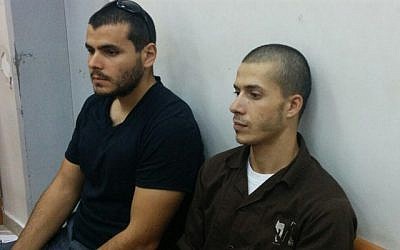 Mujahad Dar Asi (R), who was convicted of killing farmer David Bar-Kapara in 2015, attends his sentencing at the Lod District Court on September 6, 2018. (Israel Police)