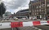 Dutch police officers near the scene of a stabbing attack near the Central Station in Amsterdam, the Netherlands, on August 31, 2018. (AP Photo/Alex Furtula)