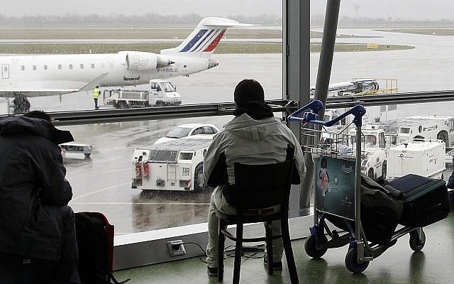 In this Dec.17, 2011 file photo, a passenger waits for his flight during at Lyon's Saint Exupery airport, central France (AP Photo/Laurent Cipriani, File) In this Dec.17, 2011 file photo, a passenger waits for his flight during at Lyon's Saint Exupery airport, central France (AP Photo/Laurent Cipriani, File)