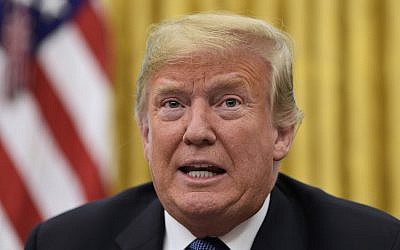 US President Donald Trump talks about Hurricane Florence following a briefing in the Oval Office of the White House in Washington, on Sept. 11, 2018. (AP Photo/Susan Walsh)
