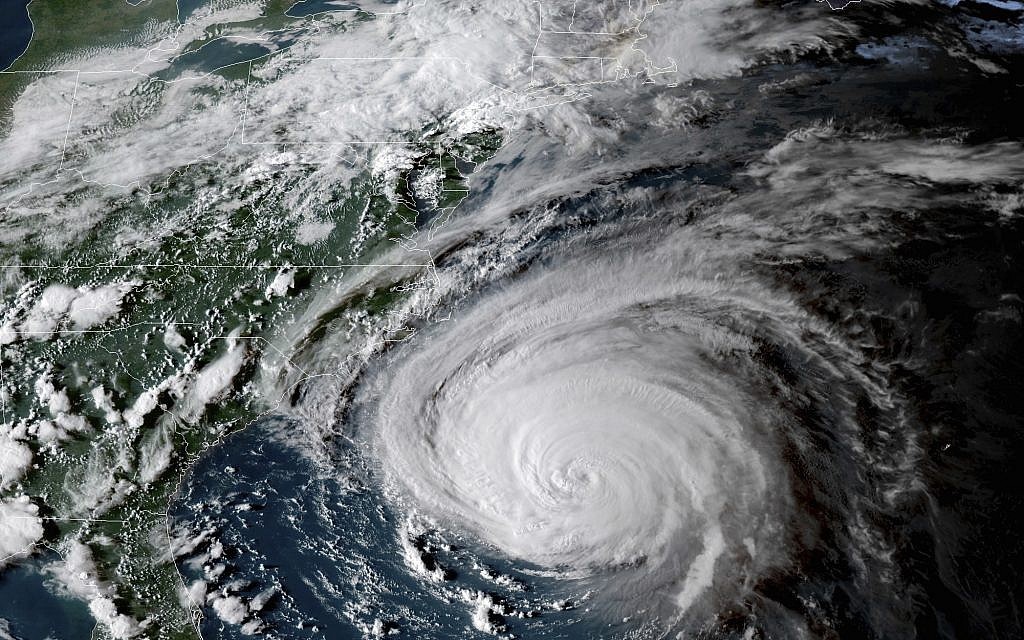 This enhanced satellite image made available by NOAA shows Hurricane Florence off the eastern coast of the United States on Wednesday, September 12, 2018 at 5:52 p.m. EDT. (NOAA via AP) This enhanced satellite image made available by NOAA shows Hurricane Florence off the eastern coast of the United States on Wednesday, September 12, 2018 at 5:52 p.m. EDT. (NOAA via AP)