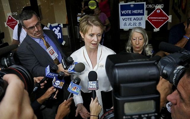 New York gubernatorial candidate Cynthia Nixon, center, speaks to members of the media outside a polling station after voting in the primary, September 13, 2018, in New York. (AP Photo/Bebeto Matthews) New York gubernatorial candidate Cynthia Nixon, center, speaks to members of the media outside a polling station after voting in the primary, September 13, 2018, in New York. (AP Photo/Bebeto Matthews)
