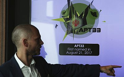 Alister Shepherd, the director of a subsidiary of the cybersecurity firm FireEye, gestures during a presentation about the APT33 hacking group, which his firm suspects are Iranian government-aligned hackers, in Dubai, United Arab Emirates, on September 18, 2018. (AP Photo/Jon Gambrell)