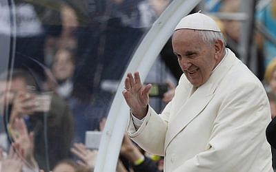 Pope Francis greets the crowd on his Popemobile as he arrives for a meeting with youths at the Cathedral Square in Vilnius, Lithuania, September 22, 2018. (AP Photo/Mindaugas Kulbis)
